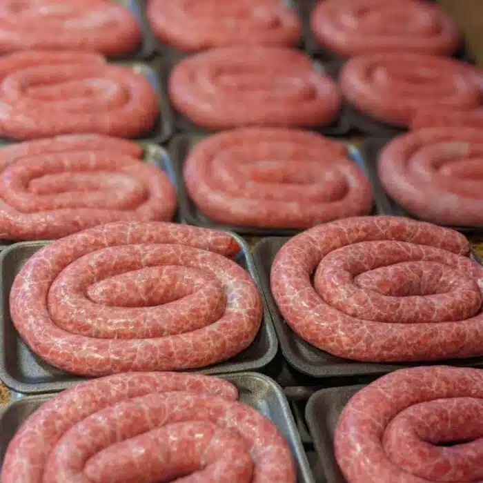 Trays of raw boerewors sausage coils