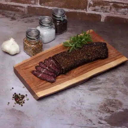 a piece of biltong slab on a wooden board