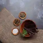 a bowl of meatsticks or droëwors and spices