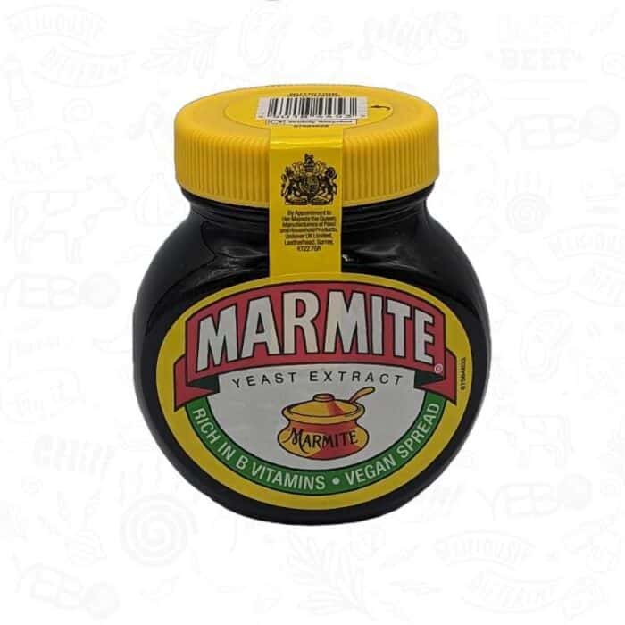 A black jar of marmite spread vegetable extract with a yellow lid