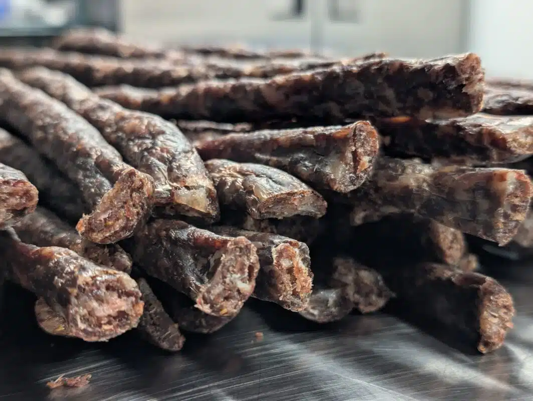 A pile of dried beef sticks or droëwors