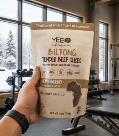 Biltong High Protein Snacks in a bag with a gym in the background