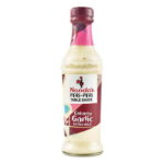 Nando’s Creamy Garlic Extra Mild Peri-Peri Sauce bottle with rich, smooth texture.