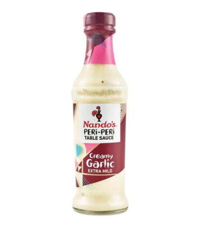 Nando’s Creamy Garlic Extra Mild Peri-Peri Sauce bottle with rich, smooth texture.