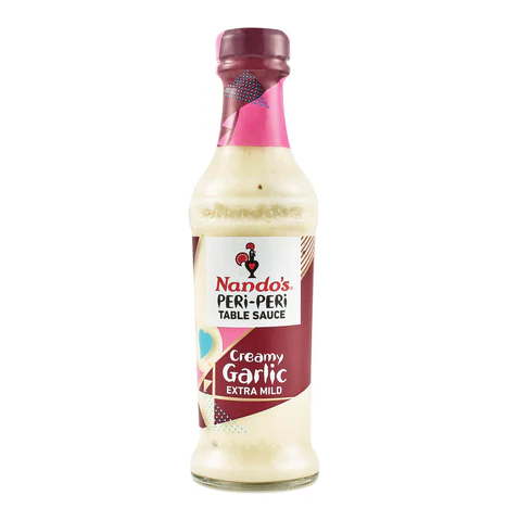 Nando’s Creamy Garlic Extra Mild Peri-Peri Sauce bottle with rich, smooth texture.